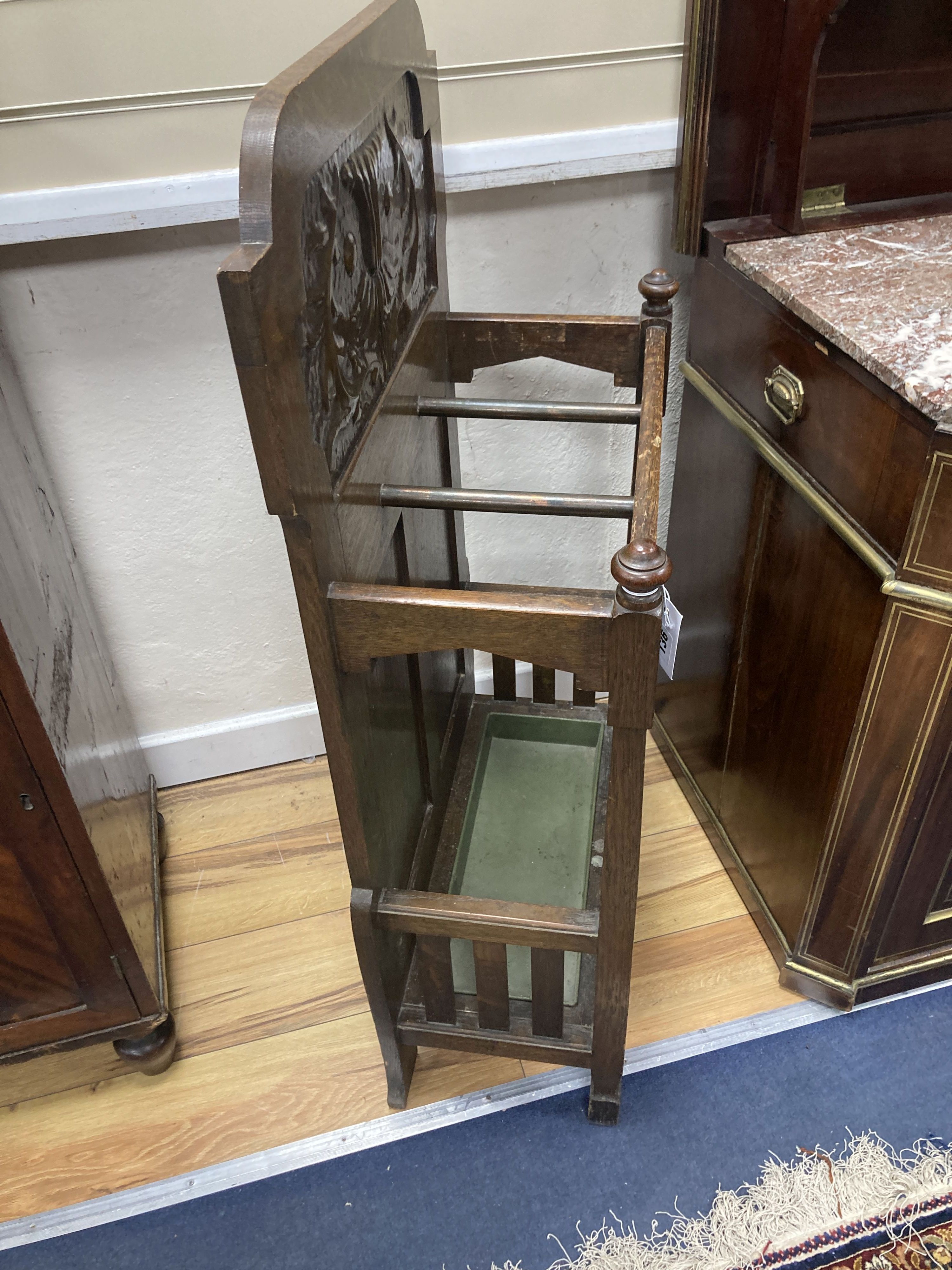 An early 20th century oak umbrella stand in the Arts & Crafts style, attributed to Shapland & Petter, width 52cm, depth 26cm, height 10